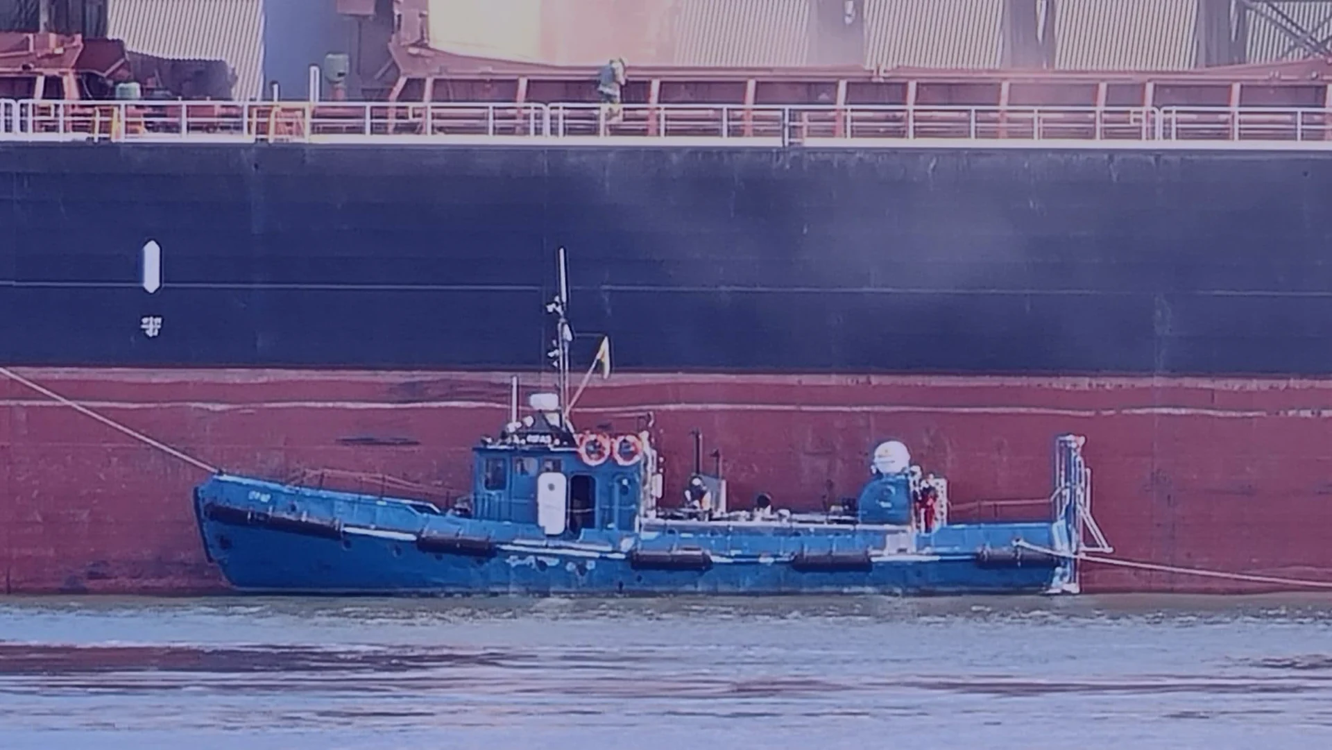 Nautilus Divers support vessel working alongside a merchant ship